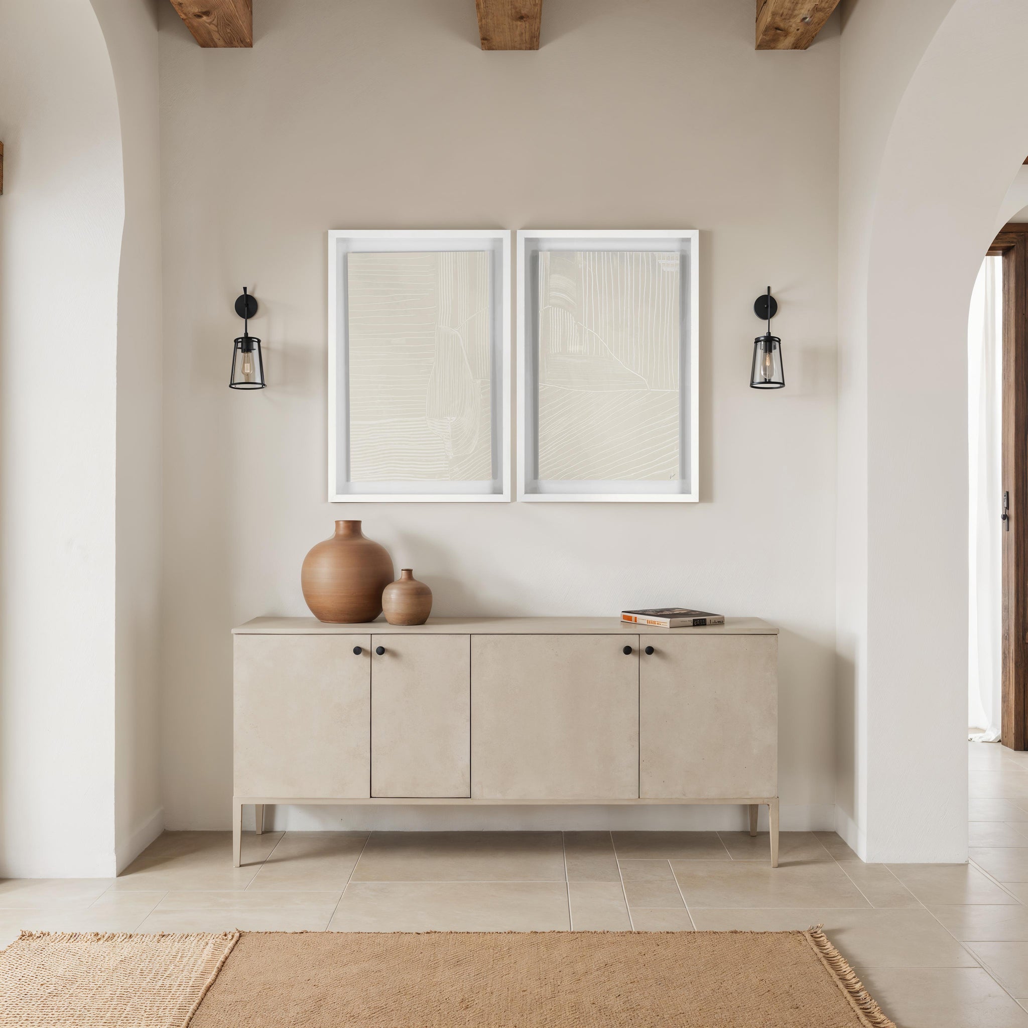Marlon wall art displayed above a beige sideboard with decorative vases.