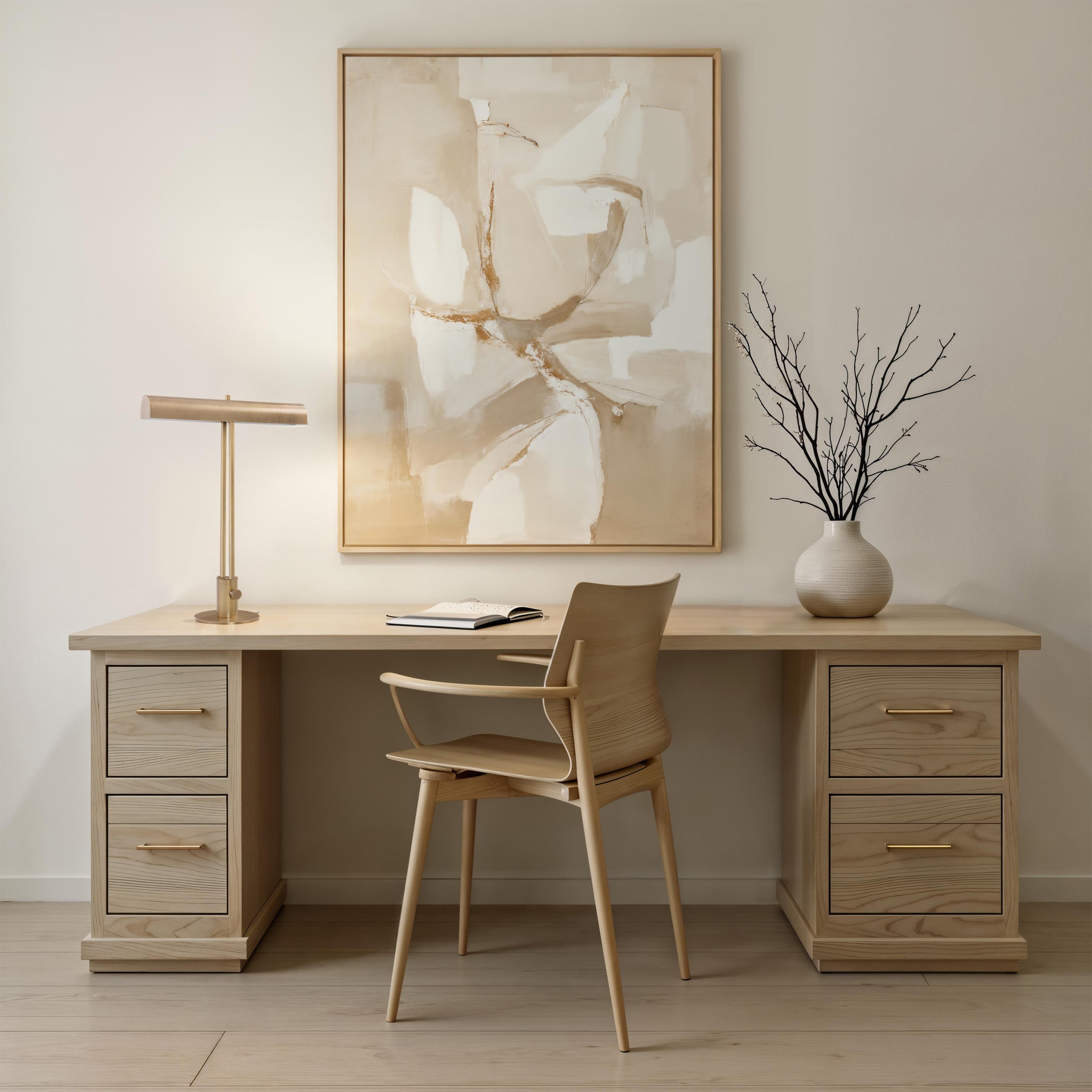 Storn Table Lamp by Renwil on a modern desk with a painting and a chair in a stylish office.