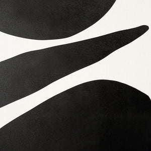 Cercola black and white abstract wall art featuring bold shapes and smooth curves on a textured background.