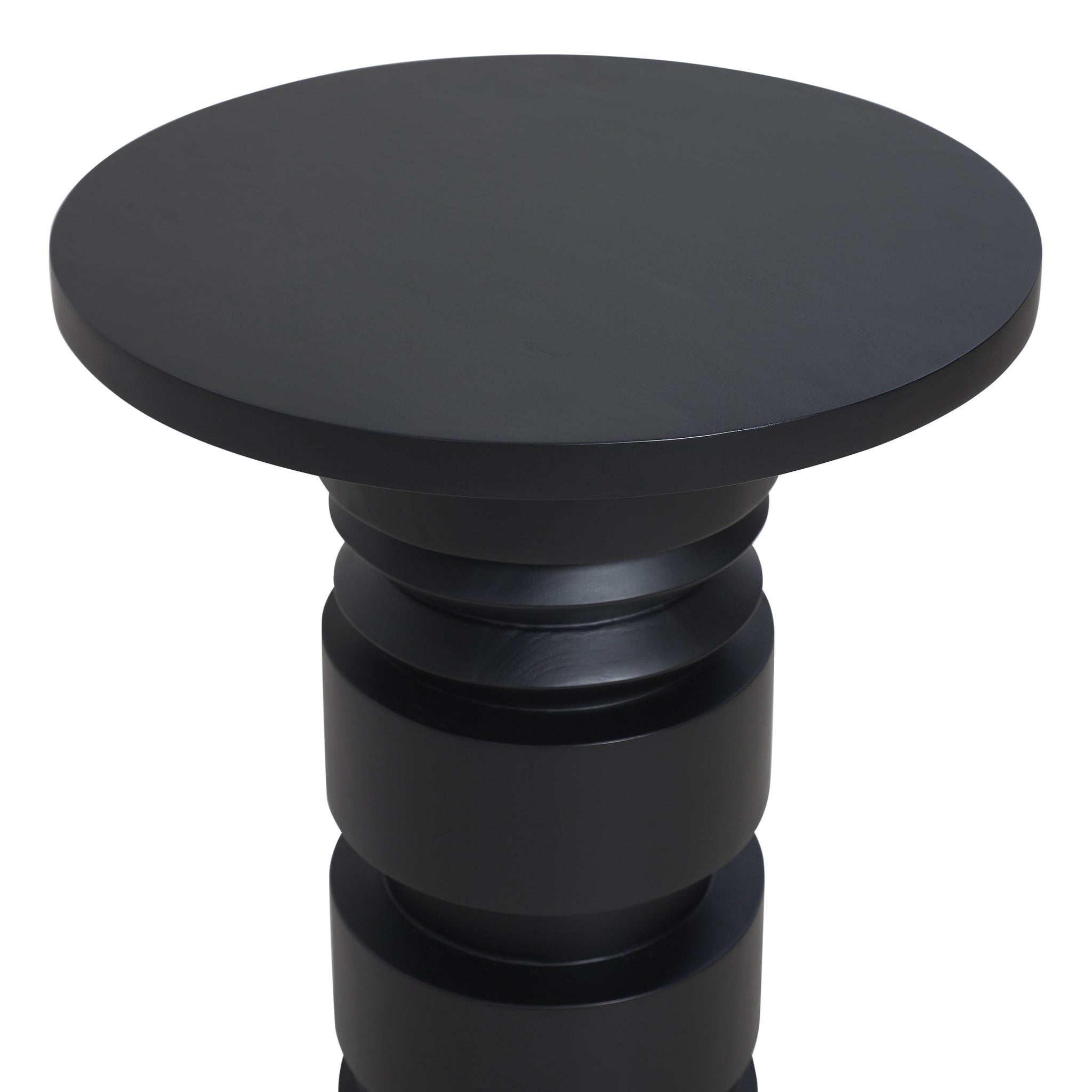 Talpa end table featuring a close-up view of its round black top and textured base.