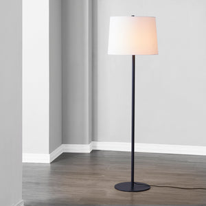 Nevin Floor Lamp illuminated, positioned in a contemporary space.