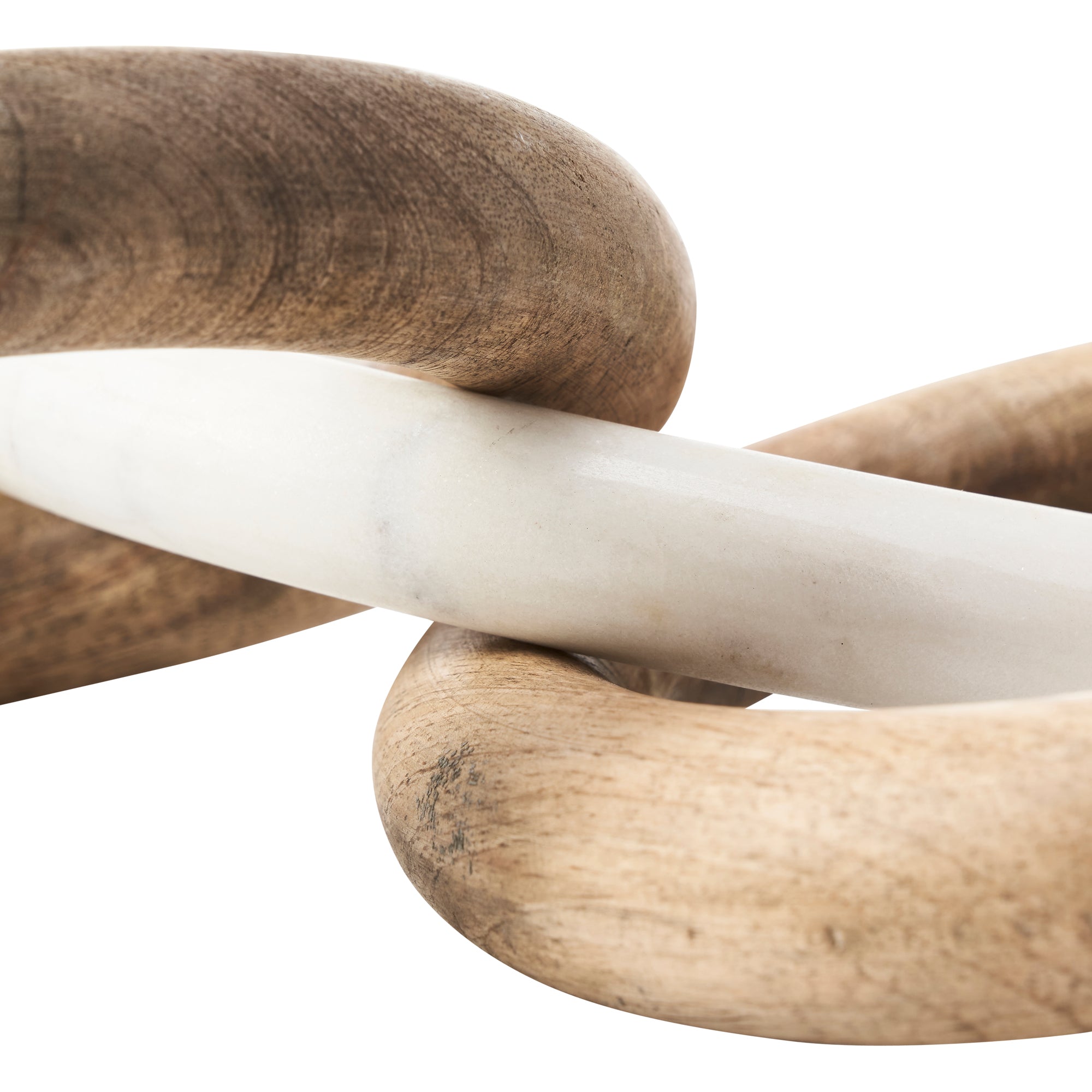 Close-up of Lusine Decorative Object with wooden and white marble rings intertwined.