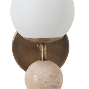 Close-up of Celestia wall sconce showing frosted glass globe and beige stone detail on brass