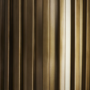 Detailed view of the ribbed design on the Fenice Flush Mount light in bronze.