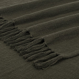 Fringe detail of Chalamet Throw Blanket in dark green, emphasizing woven edges.