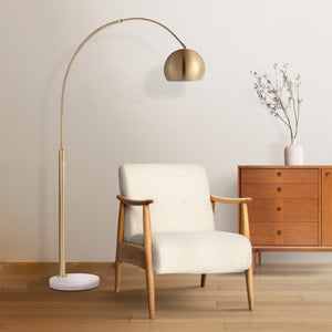 Daleela floor lamp in a living room setting next to a wooden chair and vase.