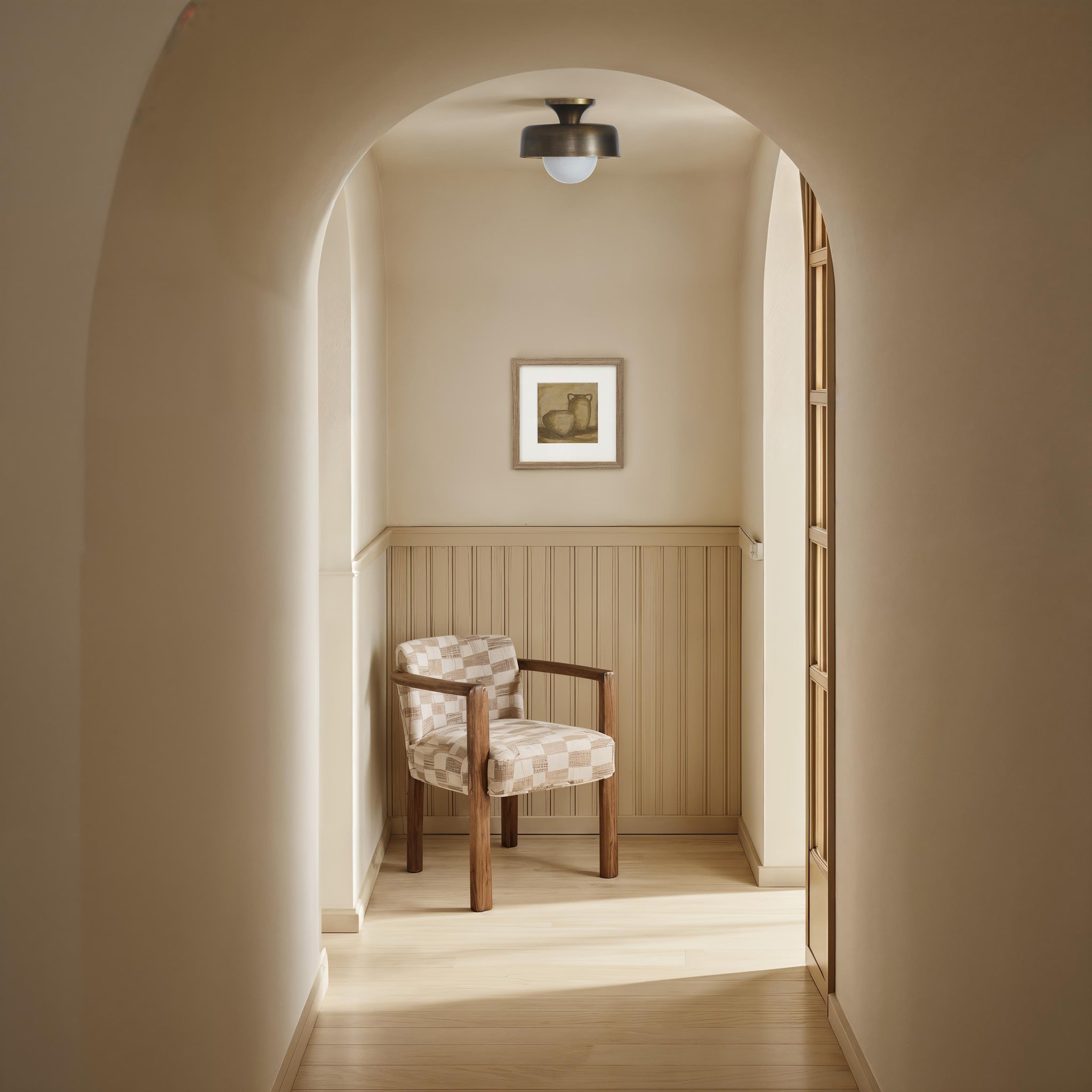 Flare Flush Mount by Renwil in a hallway with a wooden chair and light decor.