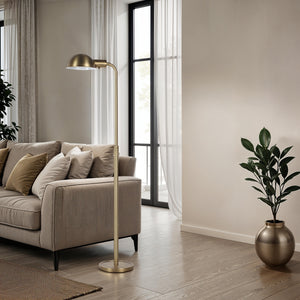Cos floor lamp in a stylish living room with a beige sofa and decorative plant.