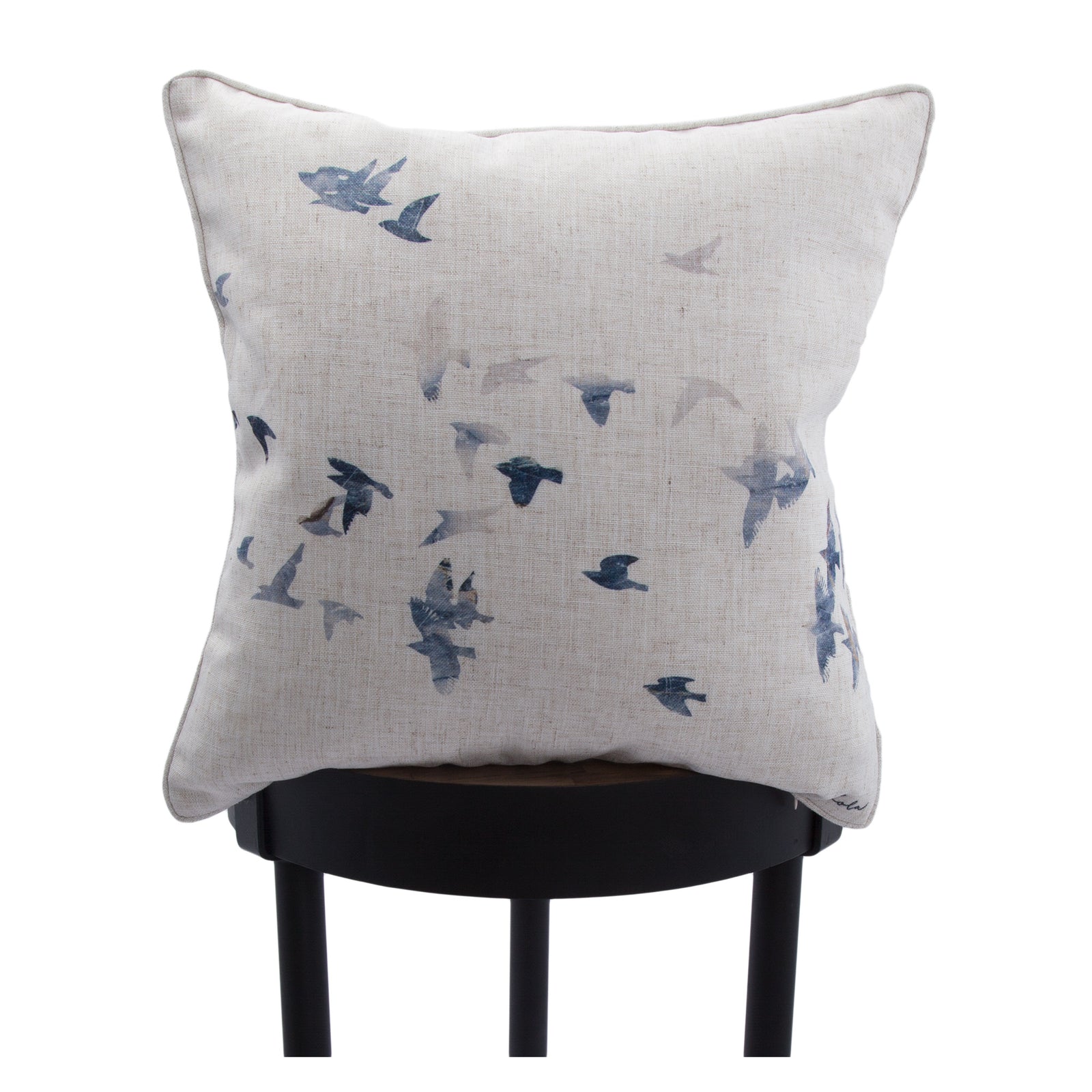 Flight indoor pillow featuring a bird pattern on a beige linen fabric.
