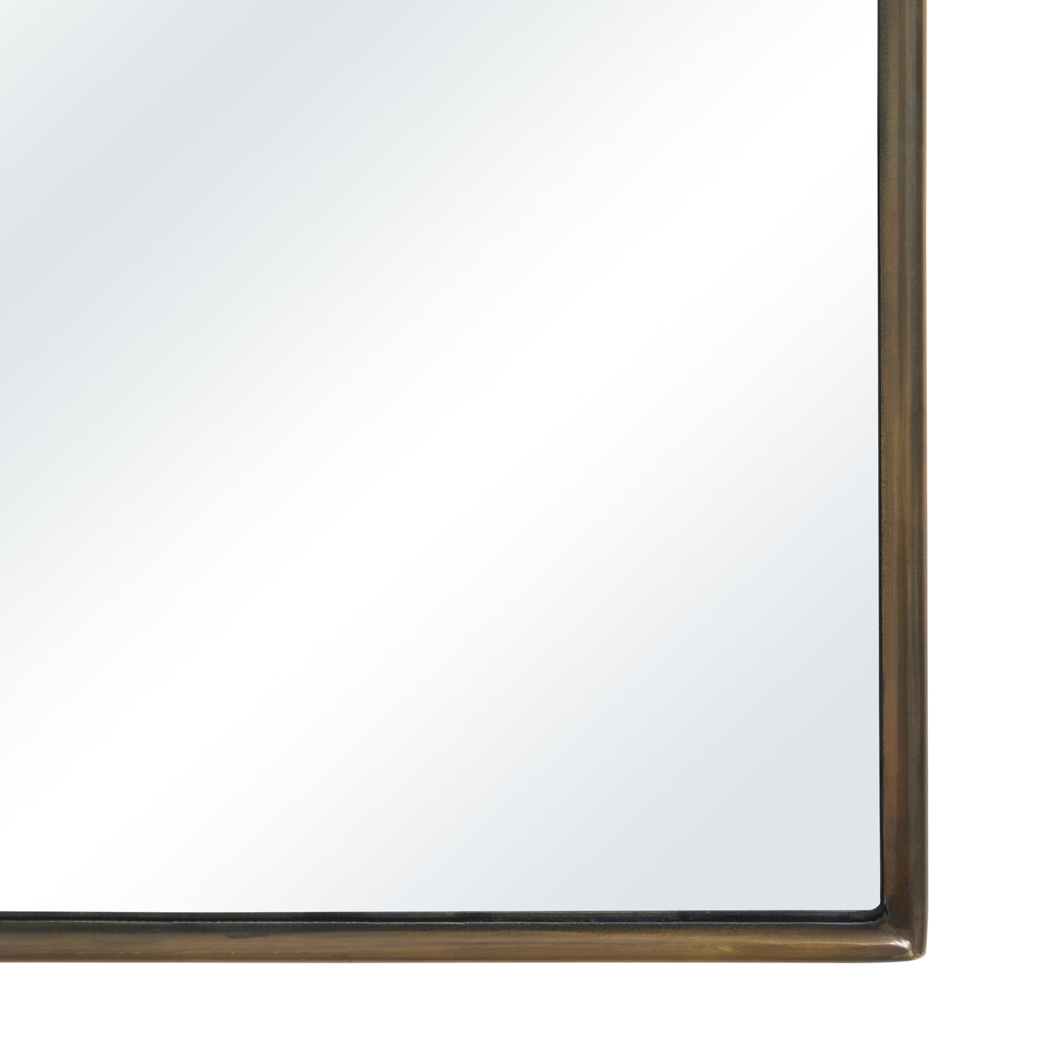 Clarisse mirror close-up of the bottom edge, highlighting the bronze frame and clear reflective surface.