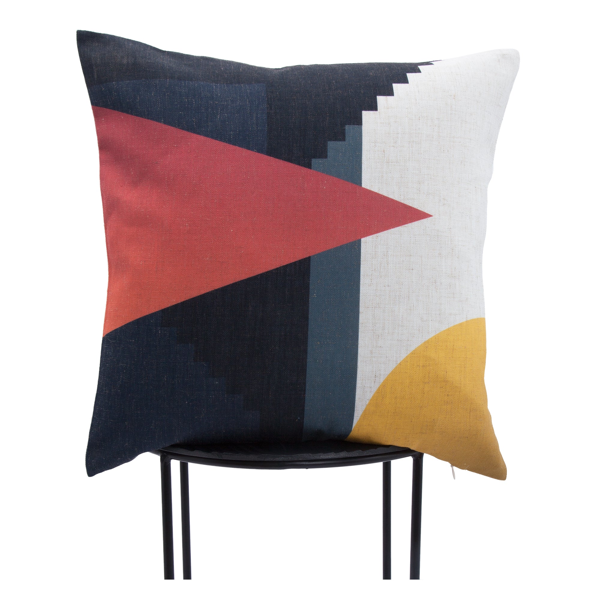 Parma Indoor Pillow displayed on a stand, showcasing bold geometric design in red, navy, and yellow.