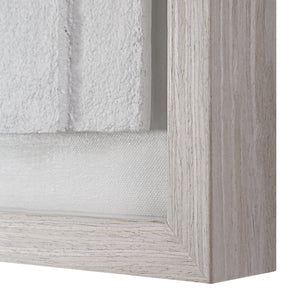 Close-up of Arches wall art frame showcasing textured white artwork