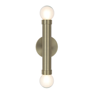 Dasia Wall Sconce in brushed brass with two lit globe bulbs, mounted vertically.