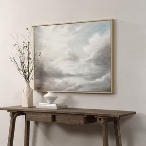 Anse canvas art displayed above a wooden table with a vase and decor.