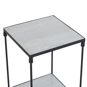 Giulia table with a light gray stone top and black metal frame, viewed from above.