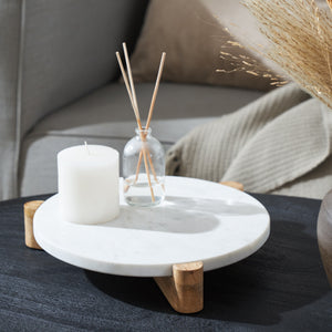 Lance marble tray styled with a candle and diffuser, round white marble top, wooden legs.