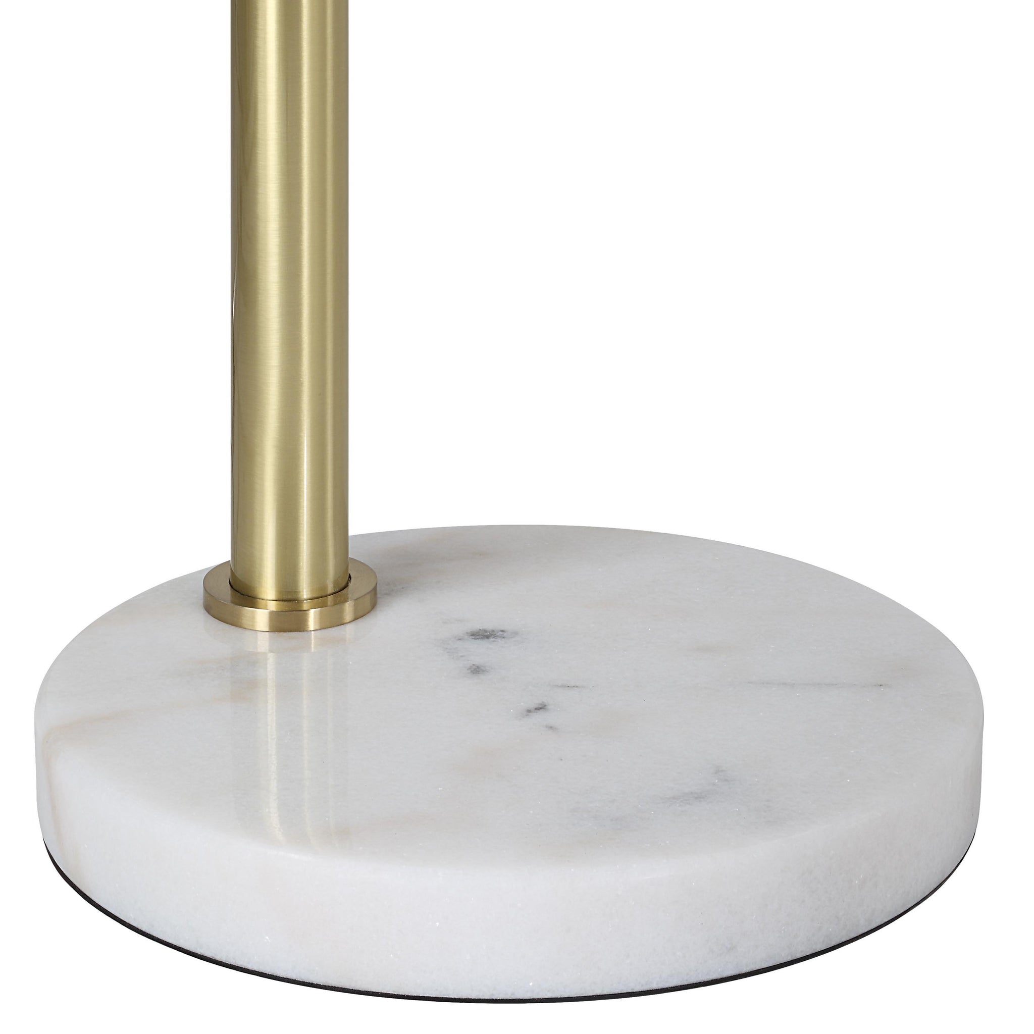Close-up of Daleela floor lamp's marble base with brass detailing.
