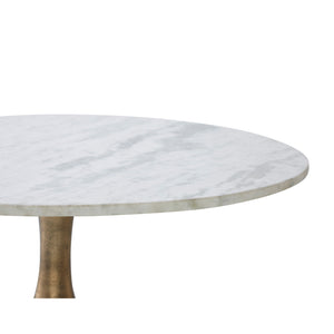 Lovisa Table featuring a close-up of the round white marble top with subtle veining.