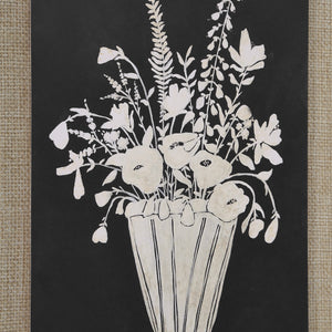 Tecoma canvas art close-up of a white floral design in a striped vase against a black surface.