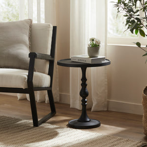 Yates Side Table styled beside a chair with a plant and books on top