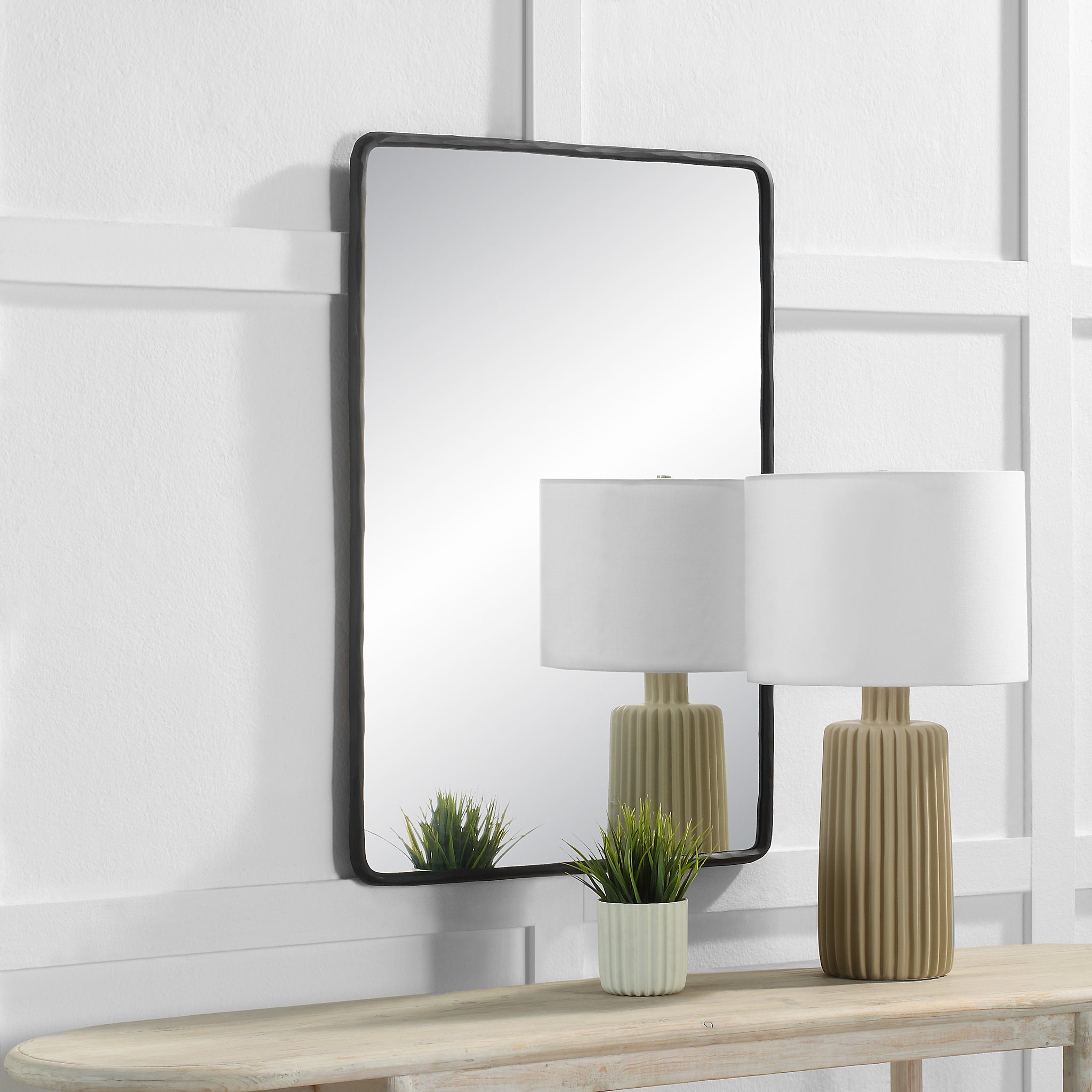 Jorah Wall Mirror displayed above a console table with a lamp and plant.