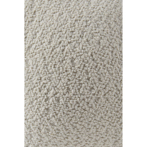 Solan Indoor Pillow in cream color, close-up of textured fabric.