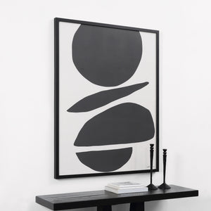 Cercola wall art displayed in a modern setting, framed in black with a black table and decor.