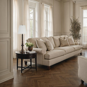Famar Table Lamp on a side table next to a beige sofa in a well-lit living room