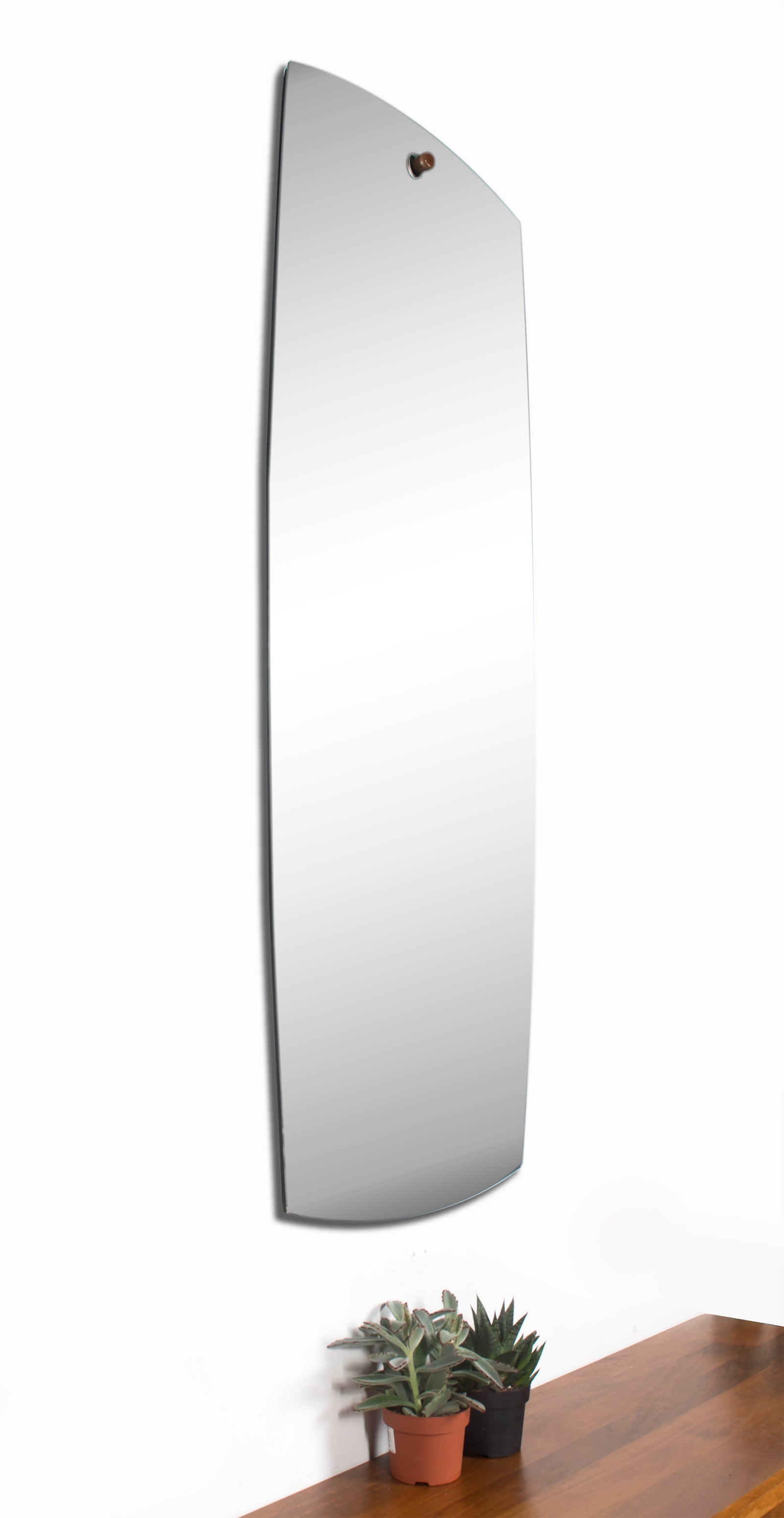 Corbel Wall Mirror with a sleek, curved design and a copper hanging fixture.