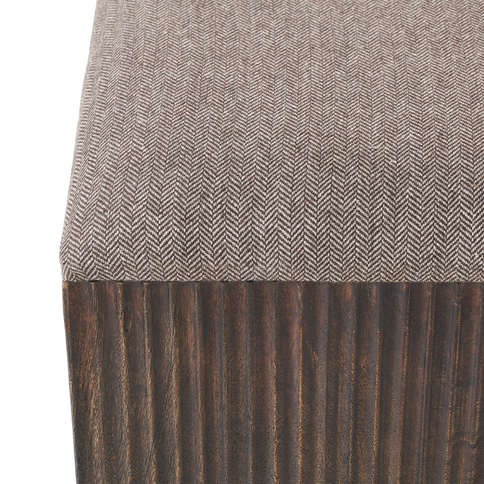 Top view of Tristan stool showcasing herringbone fabric and dark wood base.