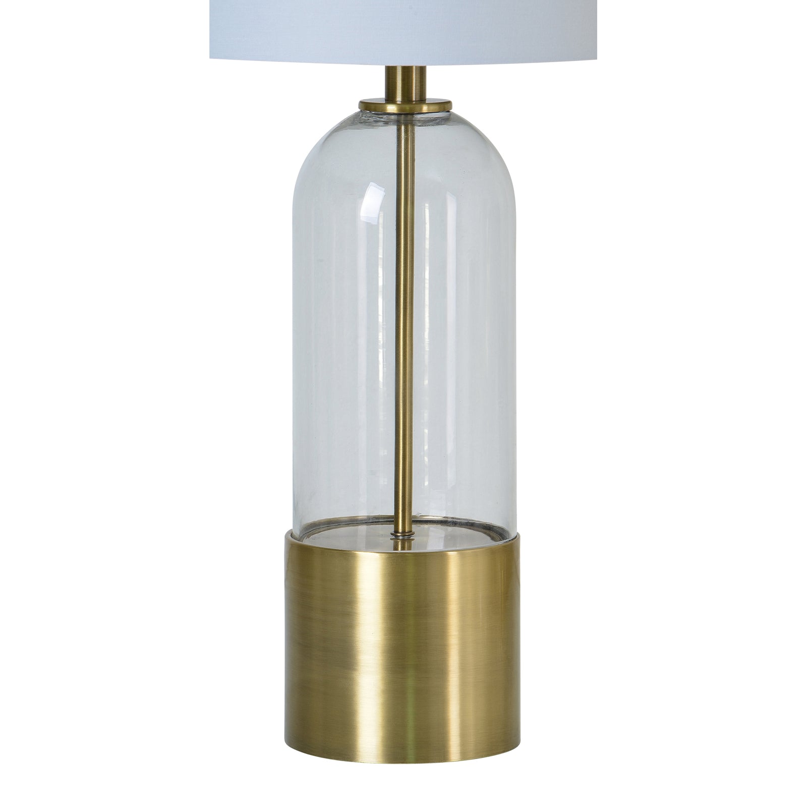 Theodore Table Lamp with a clear glass body and brass base, topped with a white fabric shade.