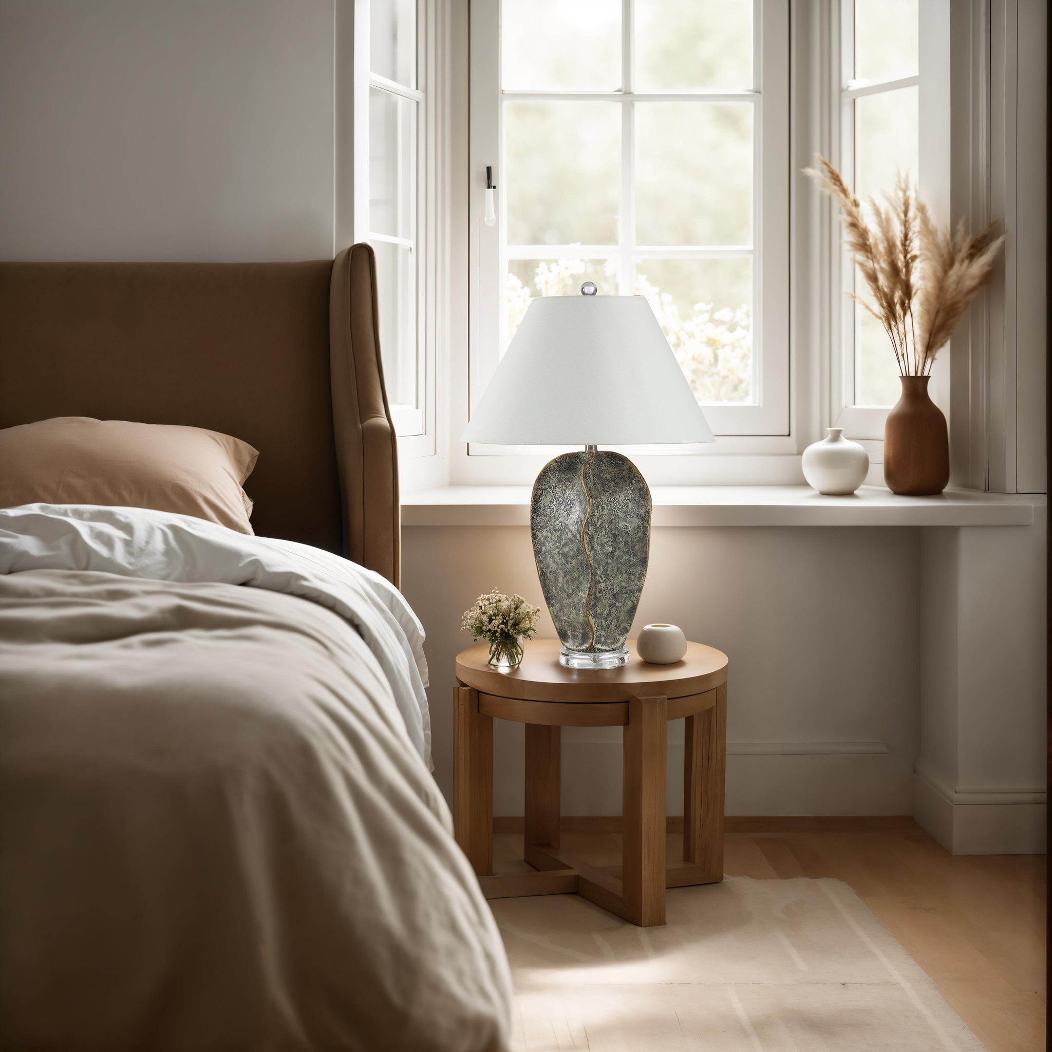 Poppi table lamp placed on a bedside table in a serene bedroom with natural elements