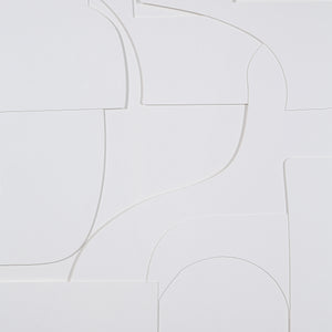 Close-up of Stardust wall art with intricate white abstract shapes on a white background.
