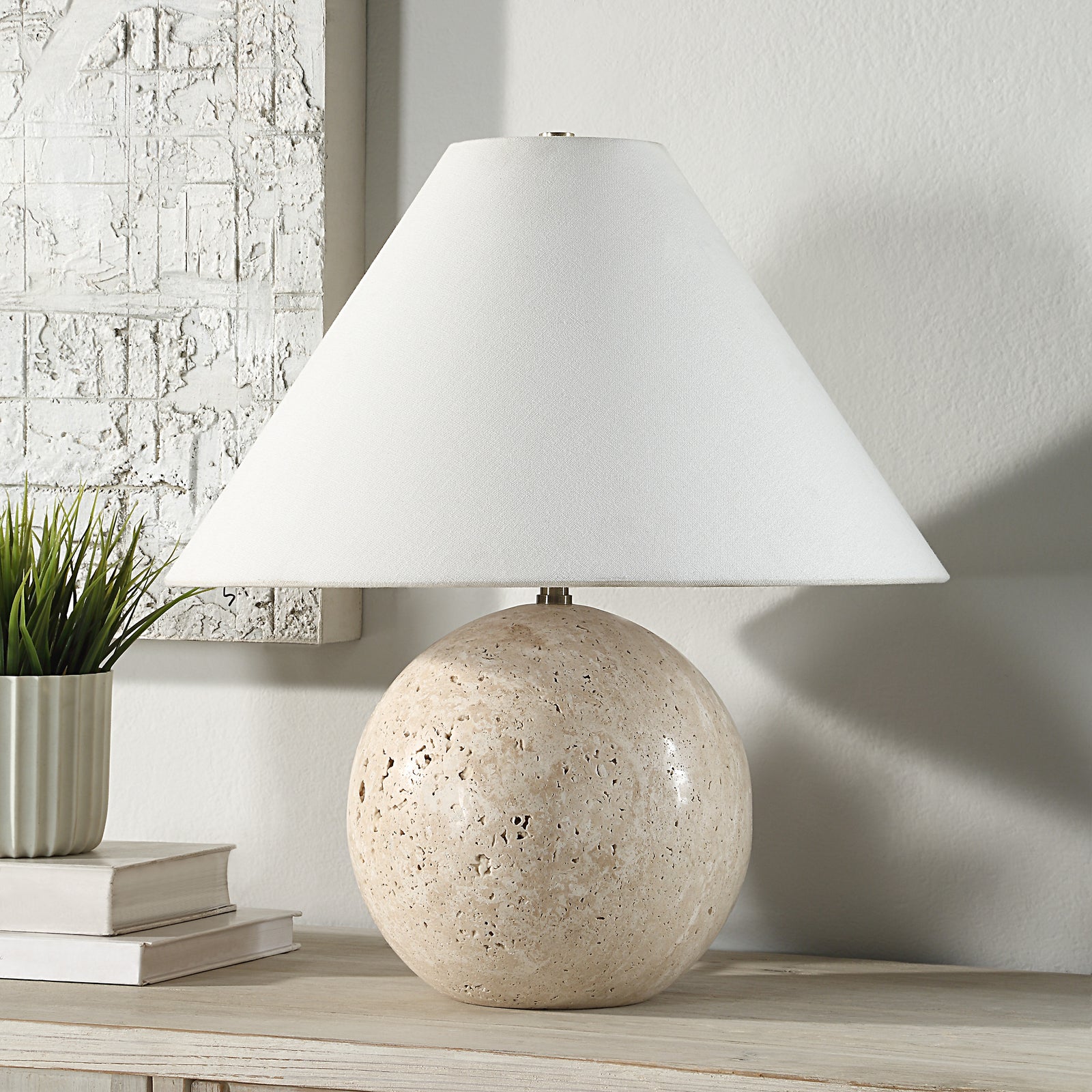 Assen Table Lamp with a round beige stone base featuring a textured surface.