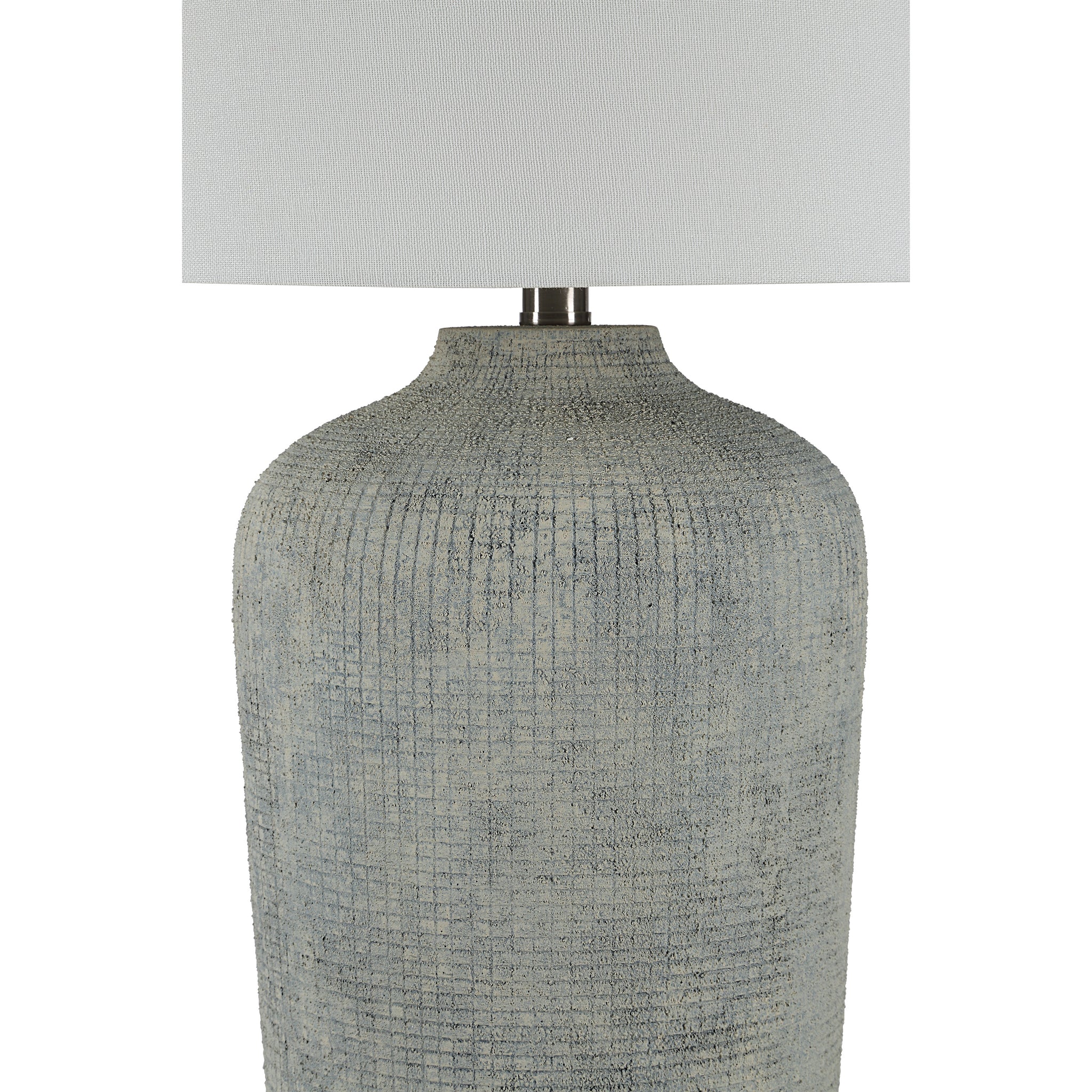 Aurelle table lamp featuring a close-up of its gray ceramic base and white shade.