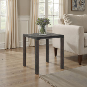 Clusia 19.0" Height Side Table styled in a living room with a vase of flowers on top