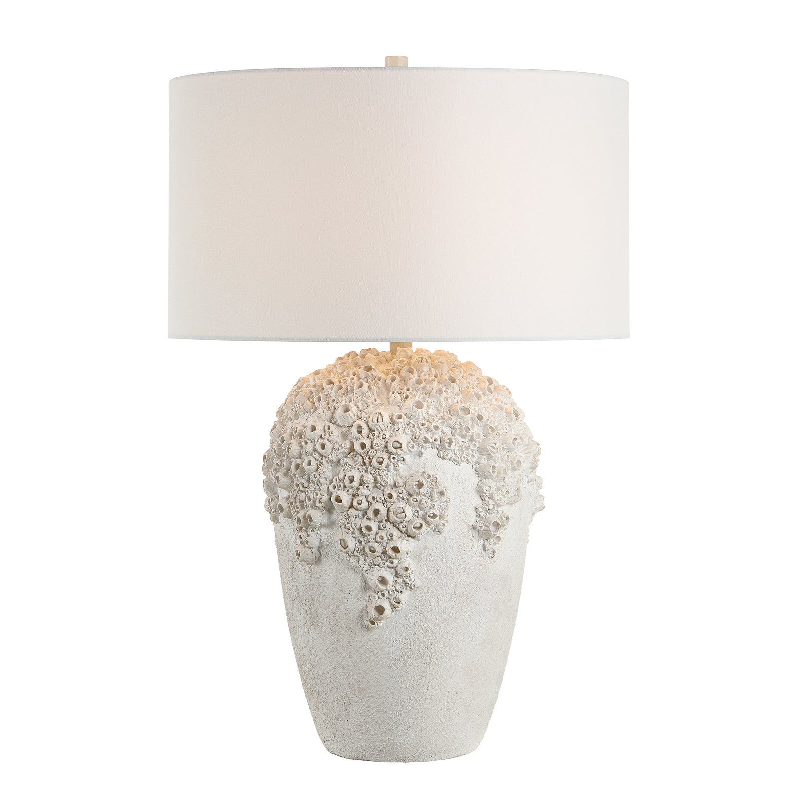 Wavy table lamp with a textured white base and a white fabric shade