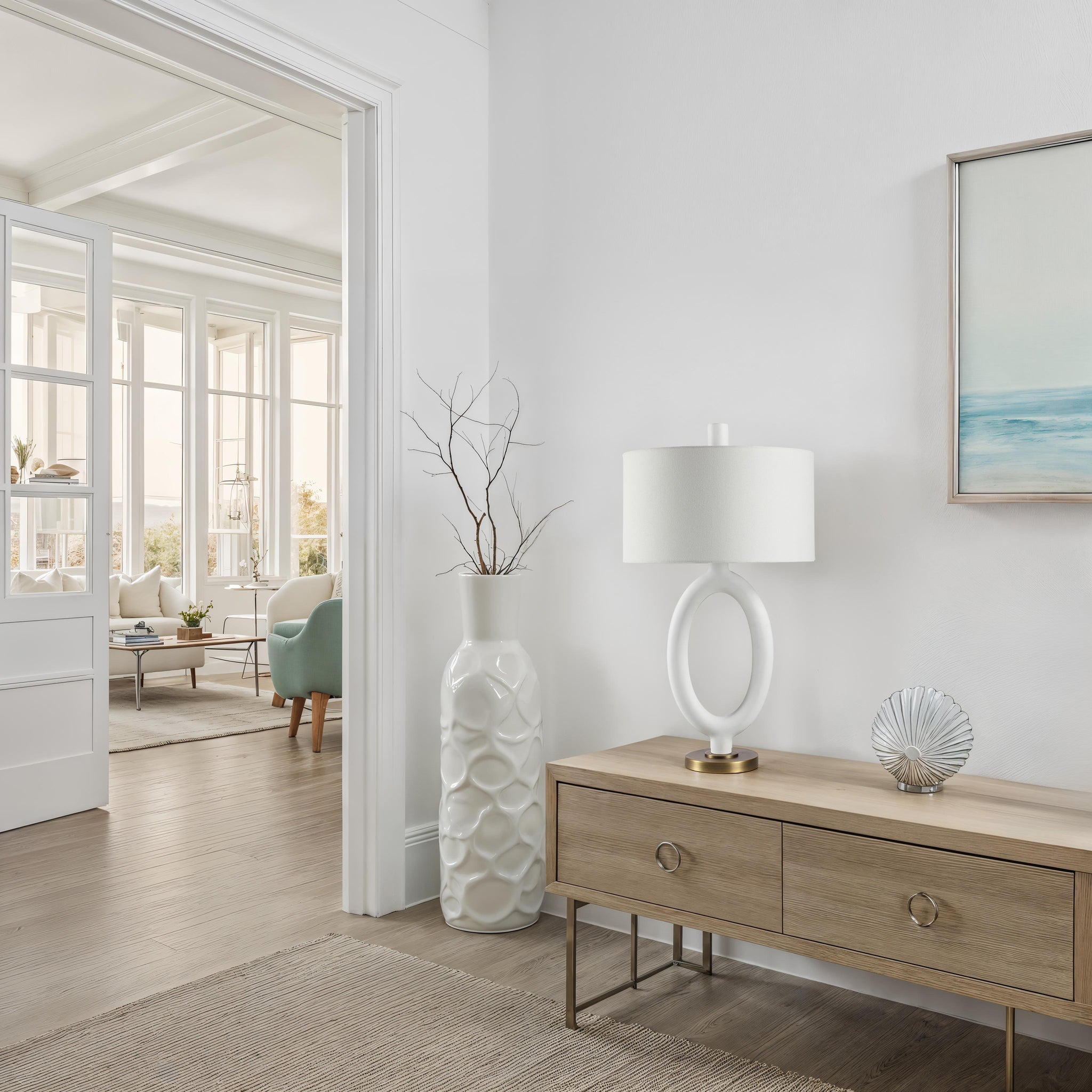 Aeris Table Lamp on a wooden console table in a bright living room with a modern decor.